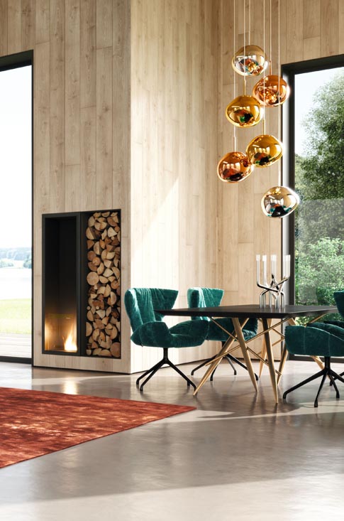 Esszimmer von Bretz Möbeln eingerichtet mit grünen Stühlen und modernem Tisch